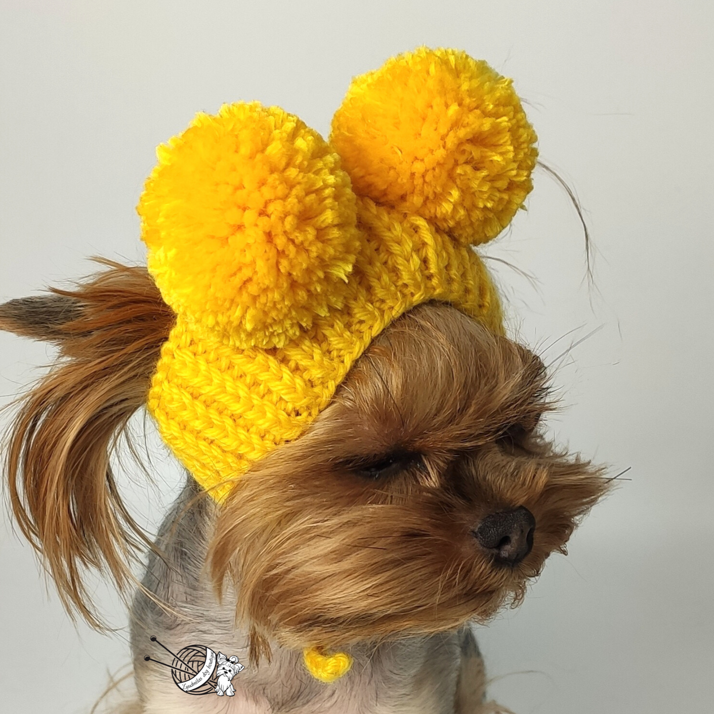 Knitted dog hat with two pompoms, handmade and custom-sized for small dogs